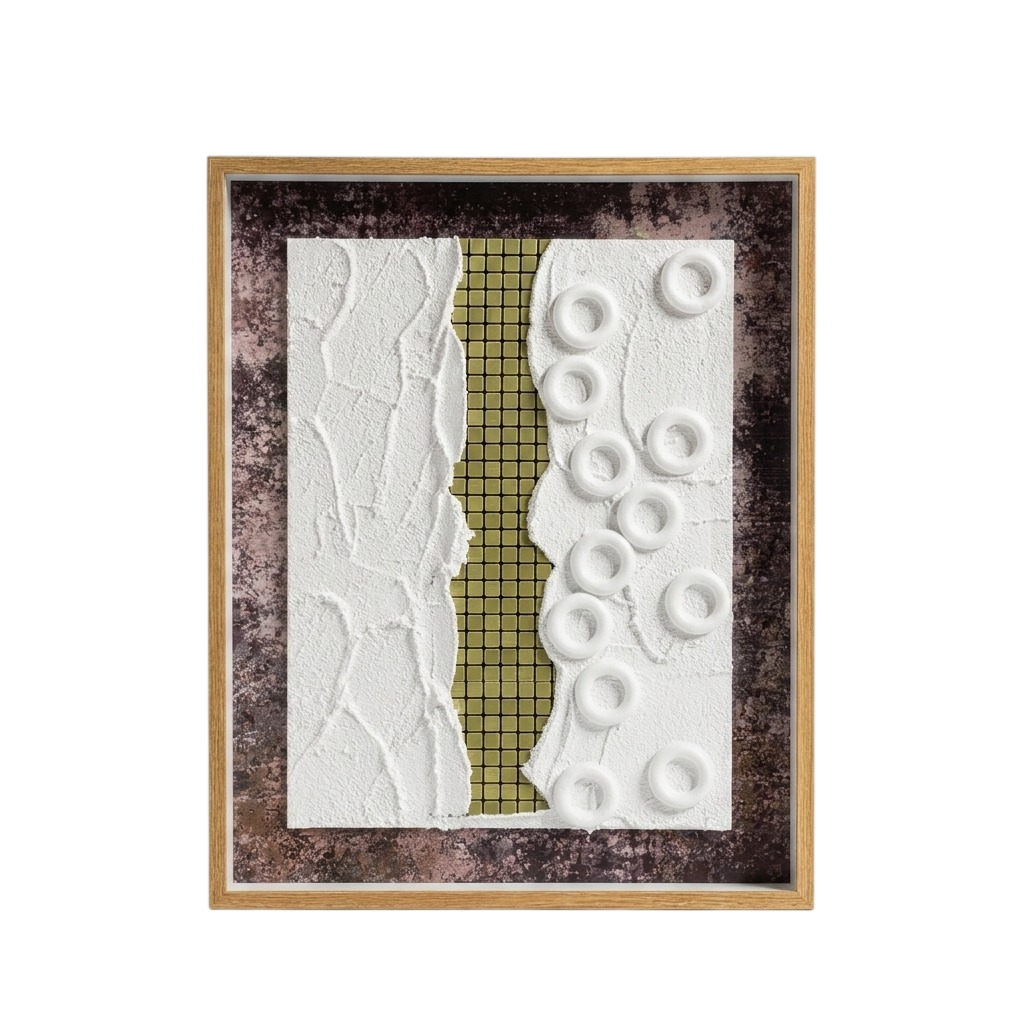 A framed abstract art piece featuring a vertical textured split design with a white crumpled-texture left side, a gold grid-patterned center strip, and a white right side with raised circular ring shapes, all set in a dark mottled background and a light wood frame.