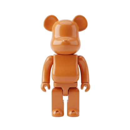 An orange bear-shaped collectible figure with rounded blocky arms and legs, standing against a plain white background.