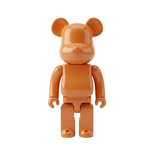 An orange bear-shaped collectible figure with rounded blocky arms and legs, standing against a plain white background.