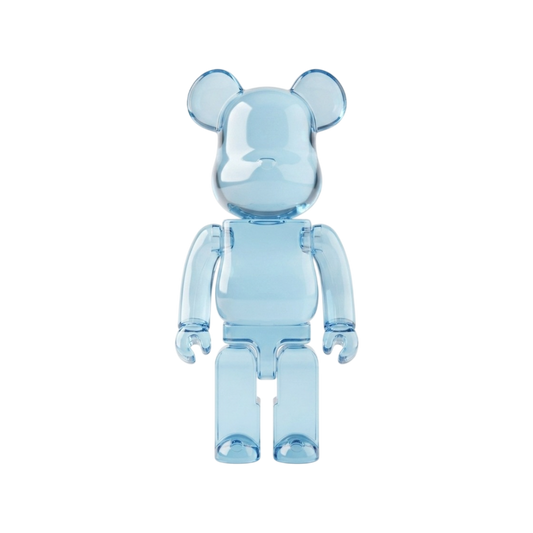 A translucent light blue bear-shaped collectible figure with rounded ears, block arms, and block legs, shown against a plain white background.