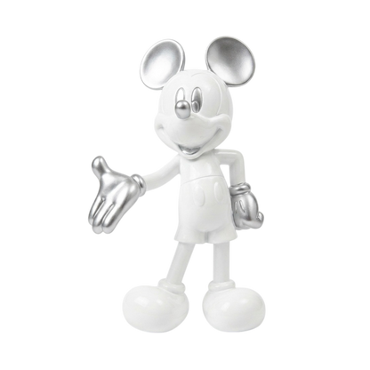 A Mickey Mouse figurine in a metallic silver finish, standing on a plain white background with one hand extended outward.