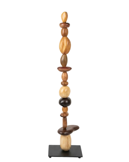Wooden sculpture with stacked cylindrical shapes on a white background