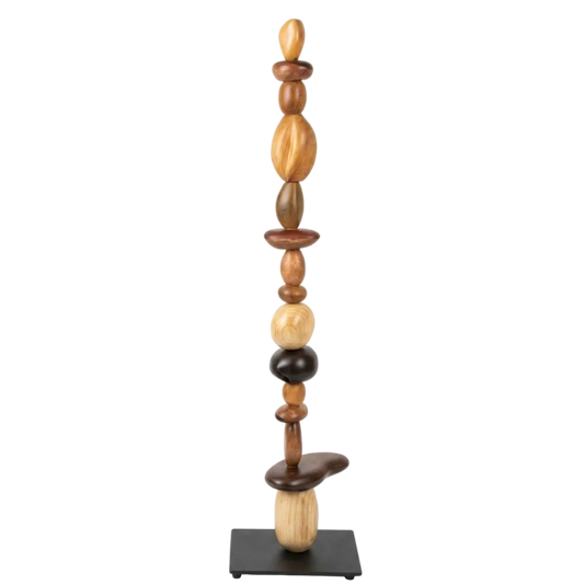 Wooden sculpture with stacked cylindrical shapes on a white background