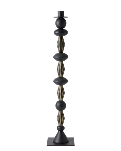 Decorative black and gold candle holder on a white background