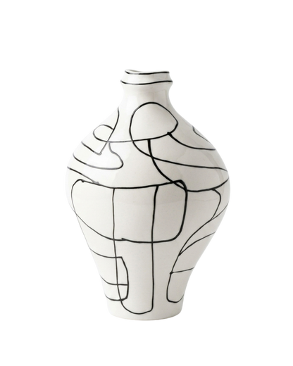 White vase with black abstract line design on a white background