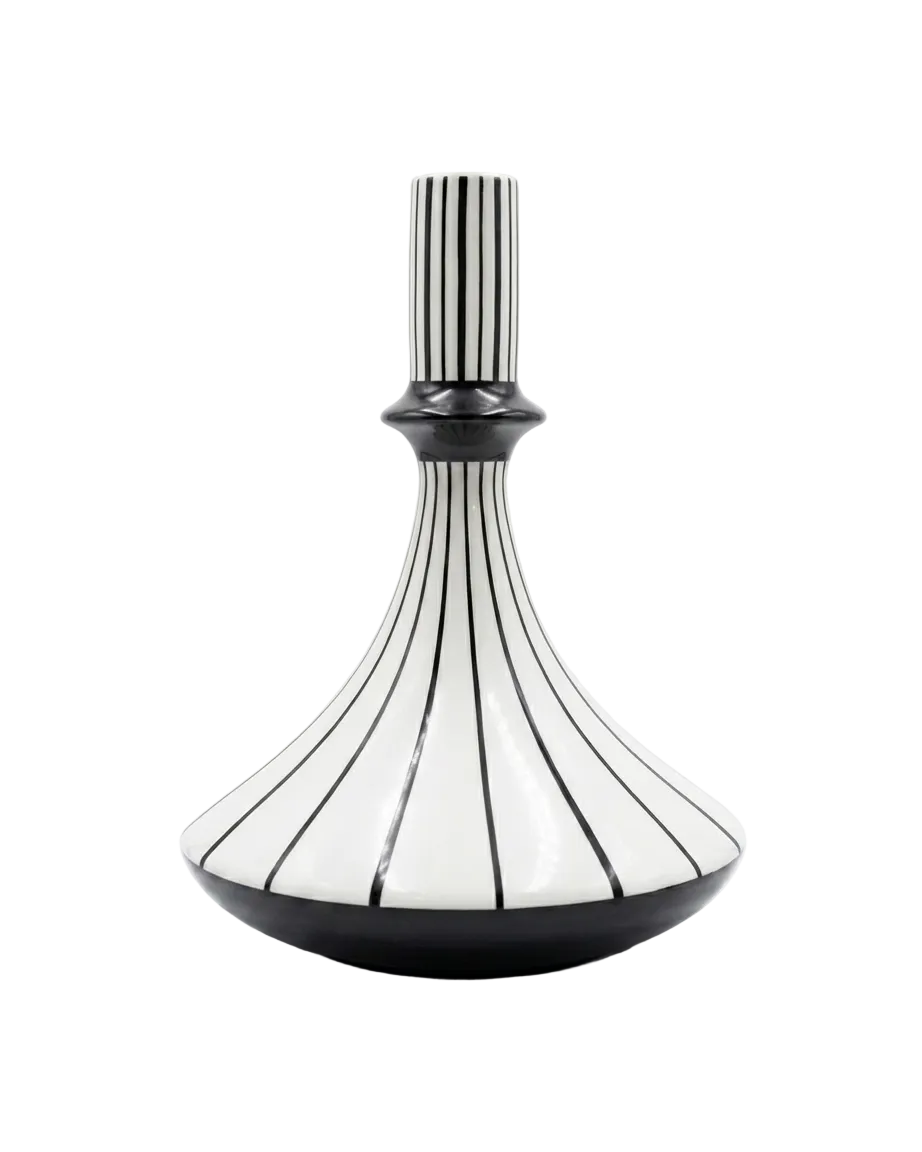 Decorative vase with black and white striped design on a white background
