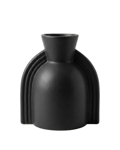 Black vase with unique design on a white background