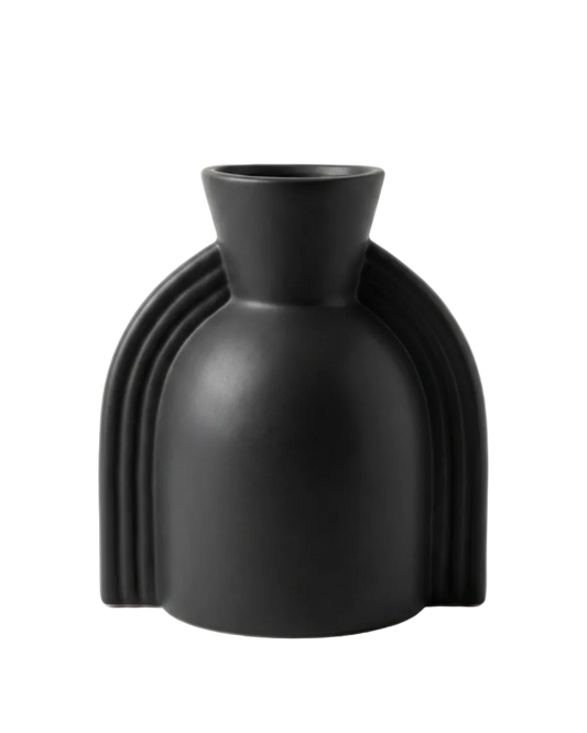 Black vase with unique design on a white background