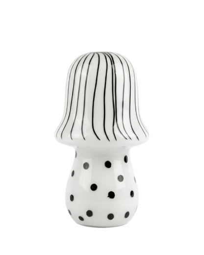 Ceramic mushroom with striped cap and polka dot body on a white background