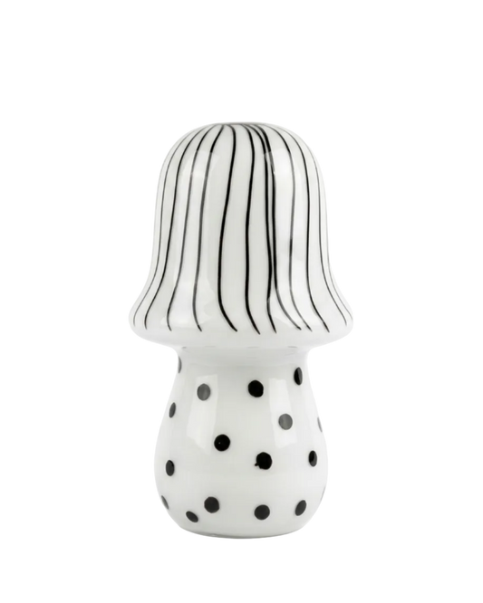 Ceramic mushroom with striped cap and polka dot body on a white background
