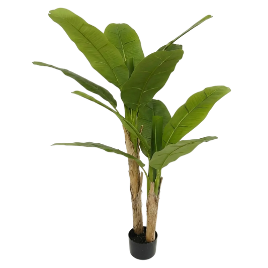 Artificial banana plant with large green leaves on a white background