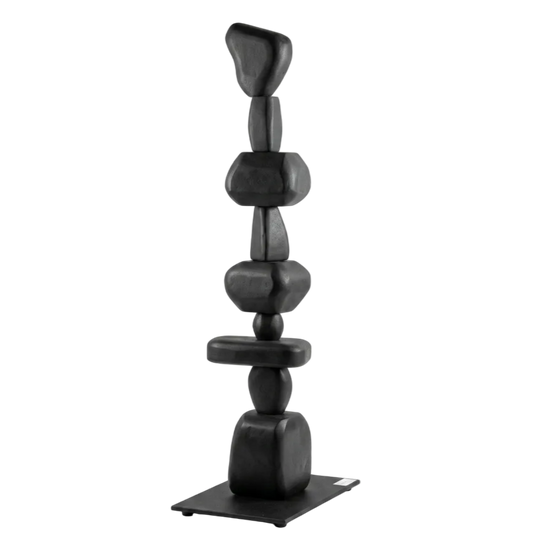 Black stone sculpture on a white background