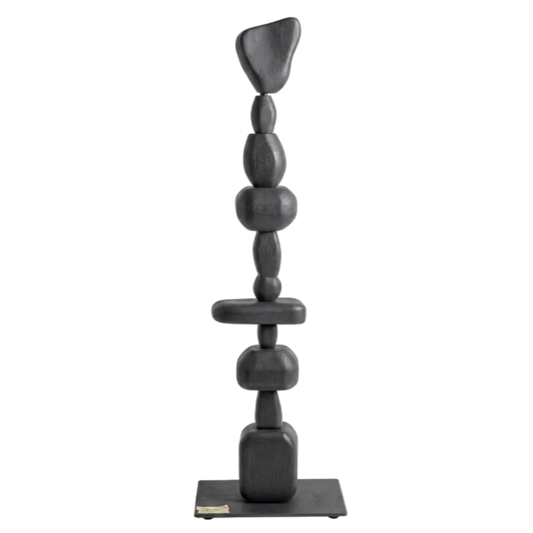 Black abstract sculpture on a white background