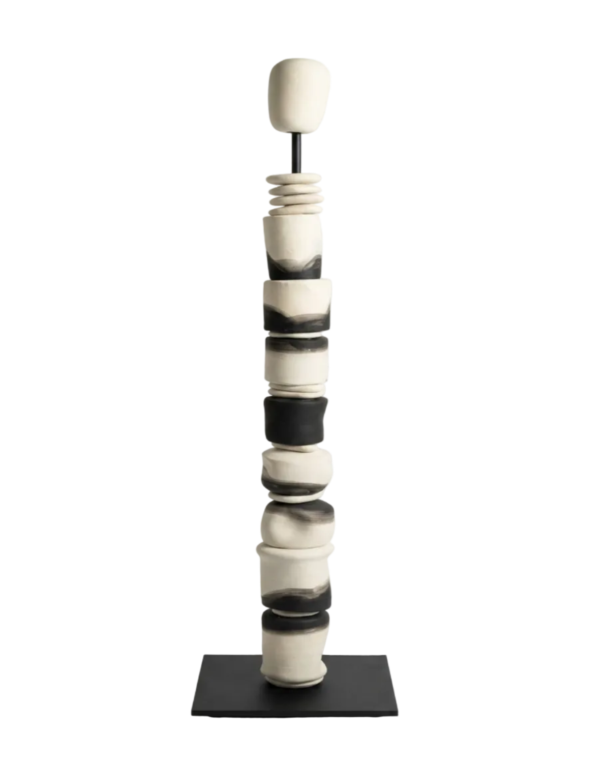 Black and white ceramic sculpture on a stand against a white background