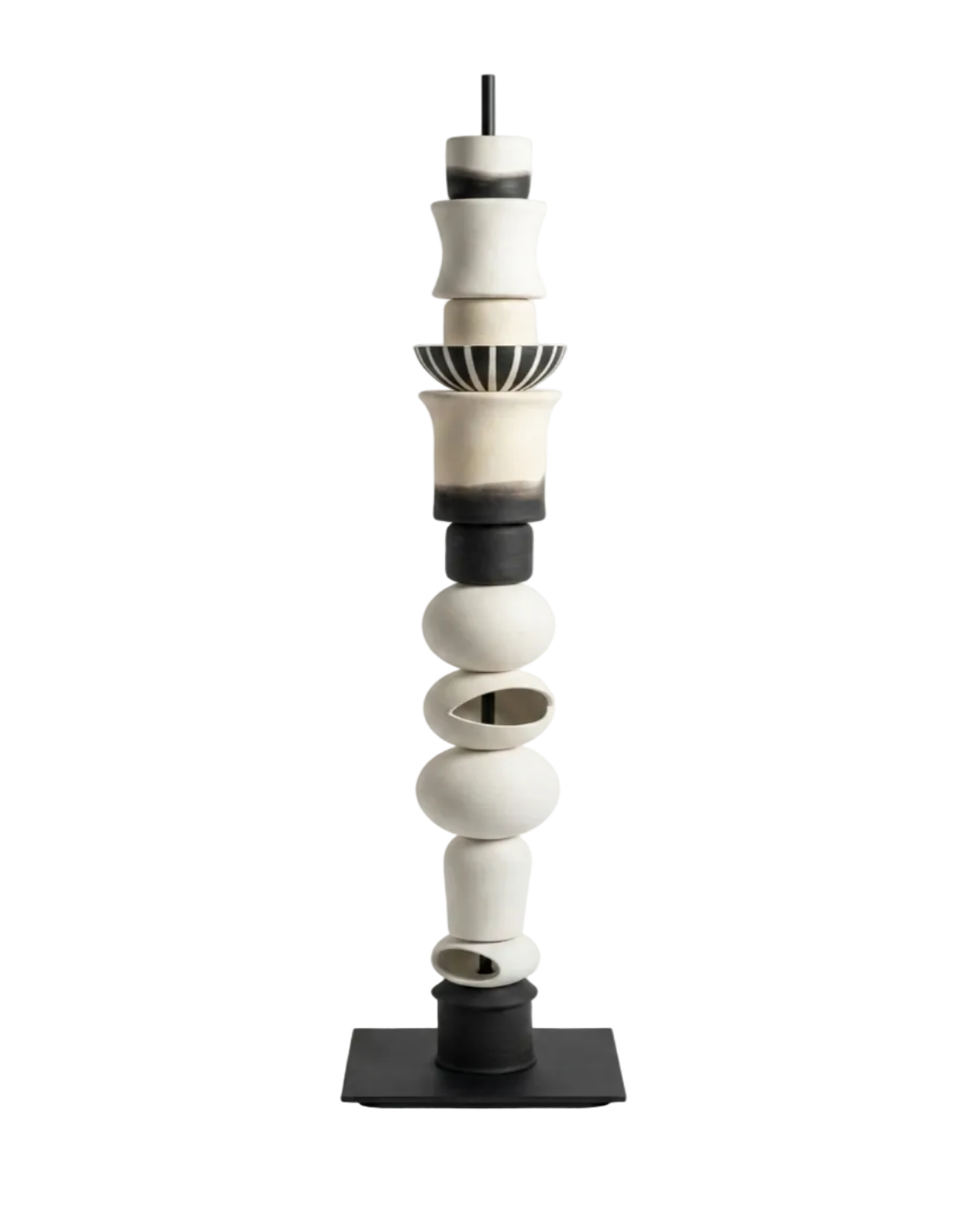 Cylindrical ceramic sculpture with black and white colors on a white background