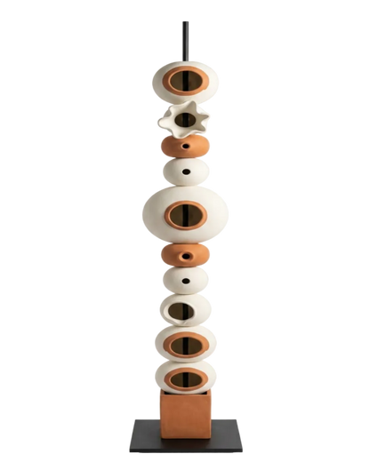 Decorative sculpture with stacked ceramic elements on a white background
