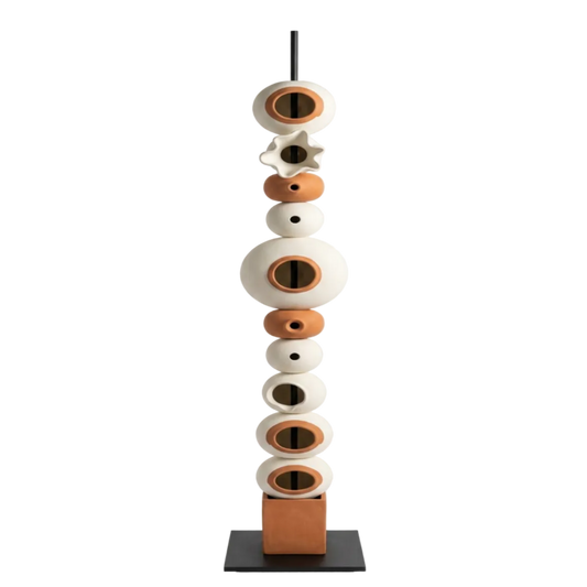 Decorative sculpture with stacked ceramic elements on a white background